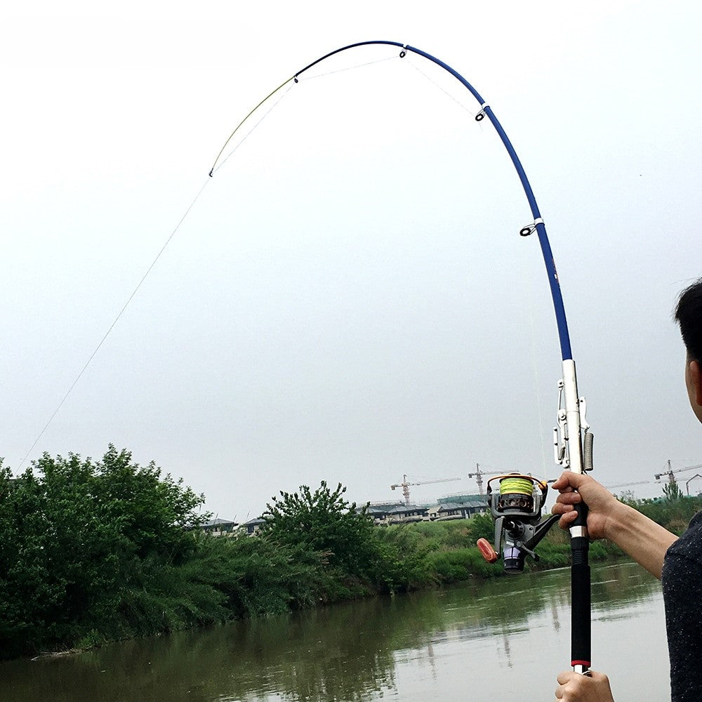 Close-up of the stainless steel automatic casting device on the fishing rod.