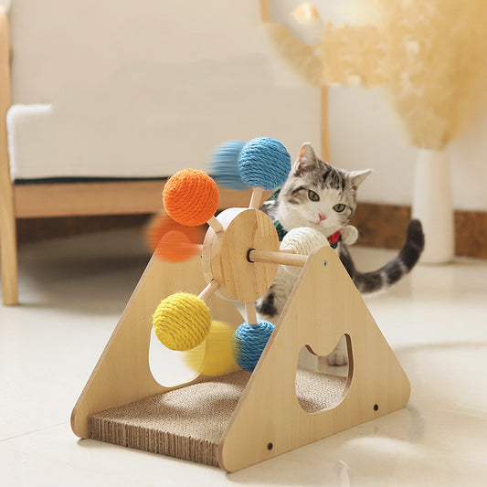 A cat scratching a solid wood rotary cat scratcher with sisal hemp surface.